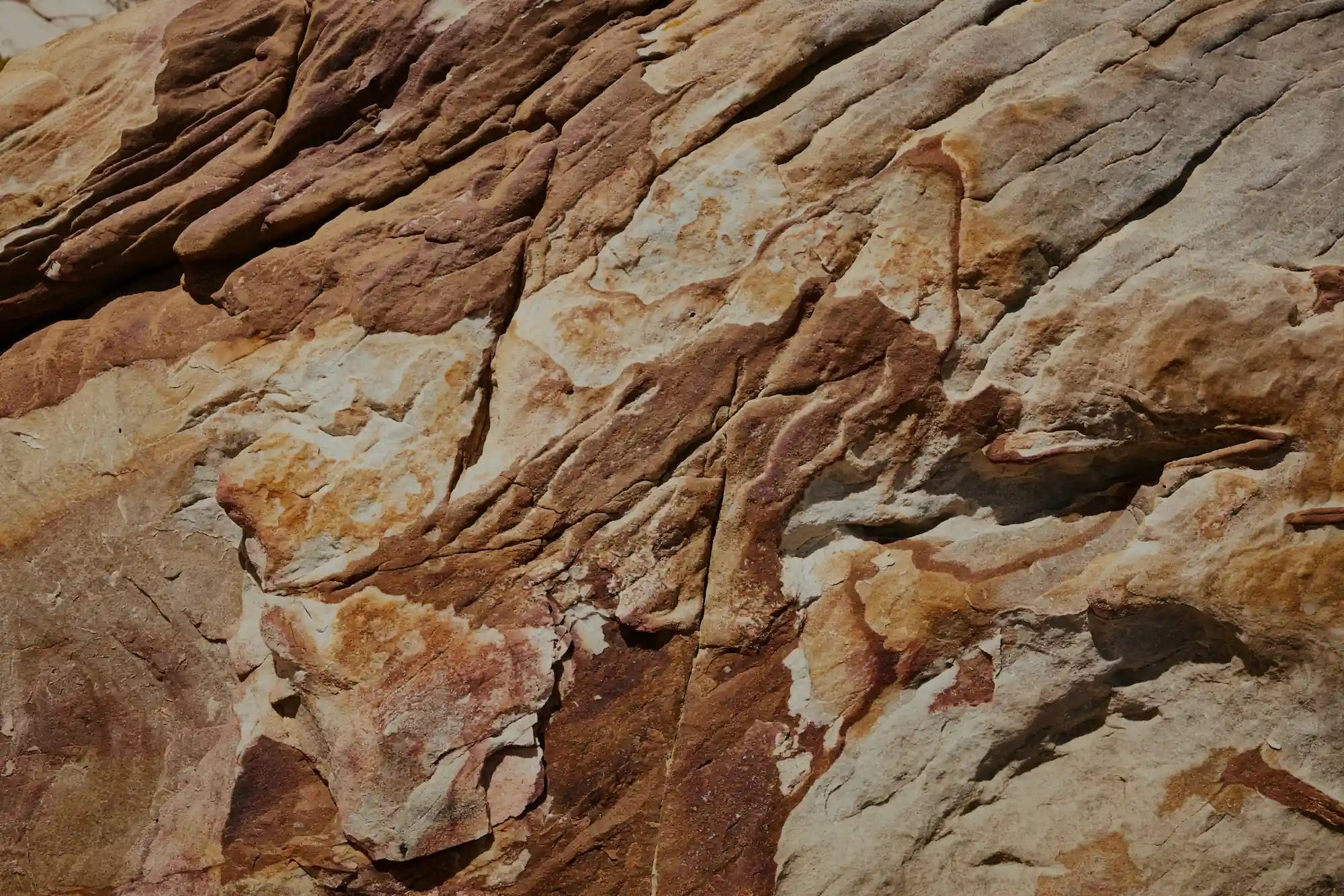 Close-up of the light cream-colored sandstone used to finish stonearts® acoustic panels.